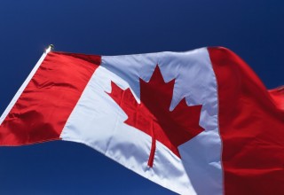 Canadian flag flapping in wind, Vancouver